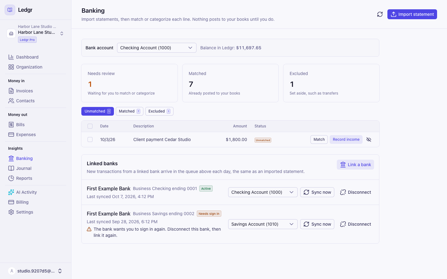 Two linked accounts. A checking account filing into Checking Account (1000) with its last synced time, Sync now and Disconnect, and a savings account marked Needs sign in