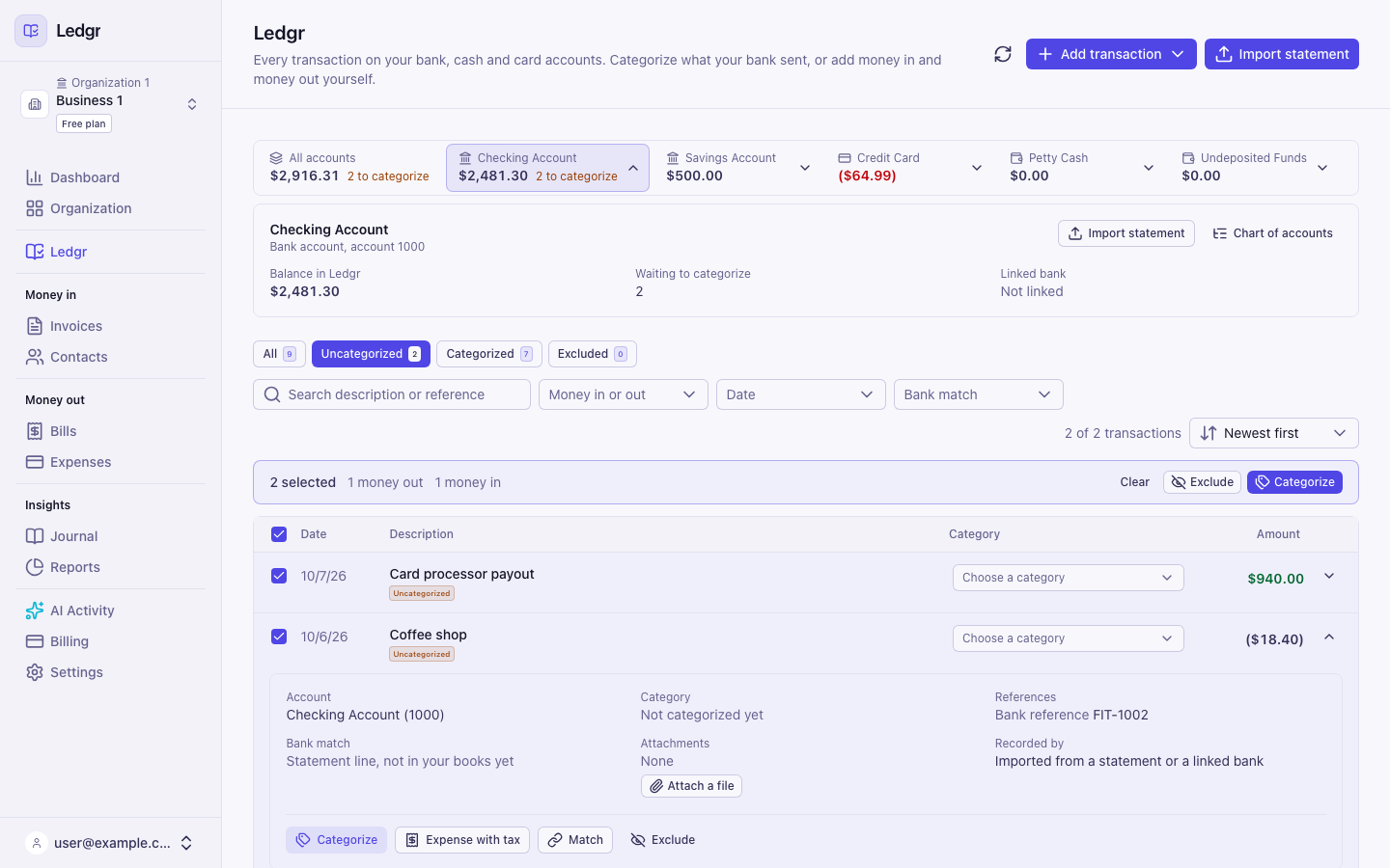 The Books page for Business 1 with the Checking Account selected and its details open, the Uncategorized tab showing two lines checked, and a bar reading 2 selected with Exclude and Categorize buttons